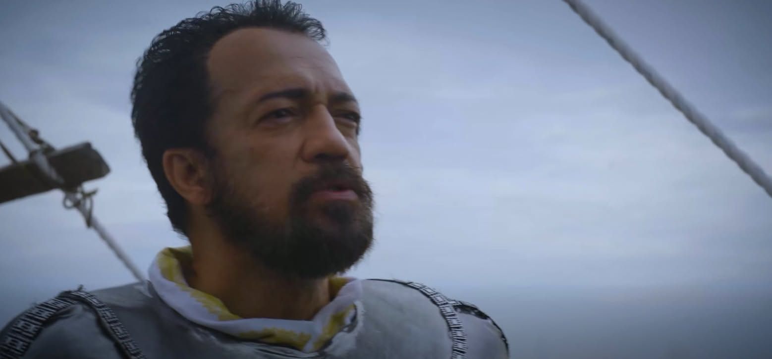 A bearded Spanish captain in armour on the deck of a ship