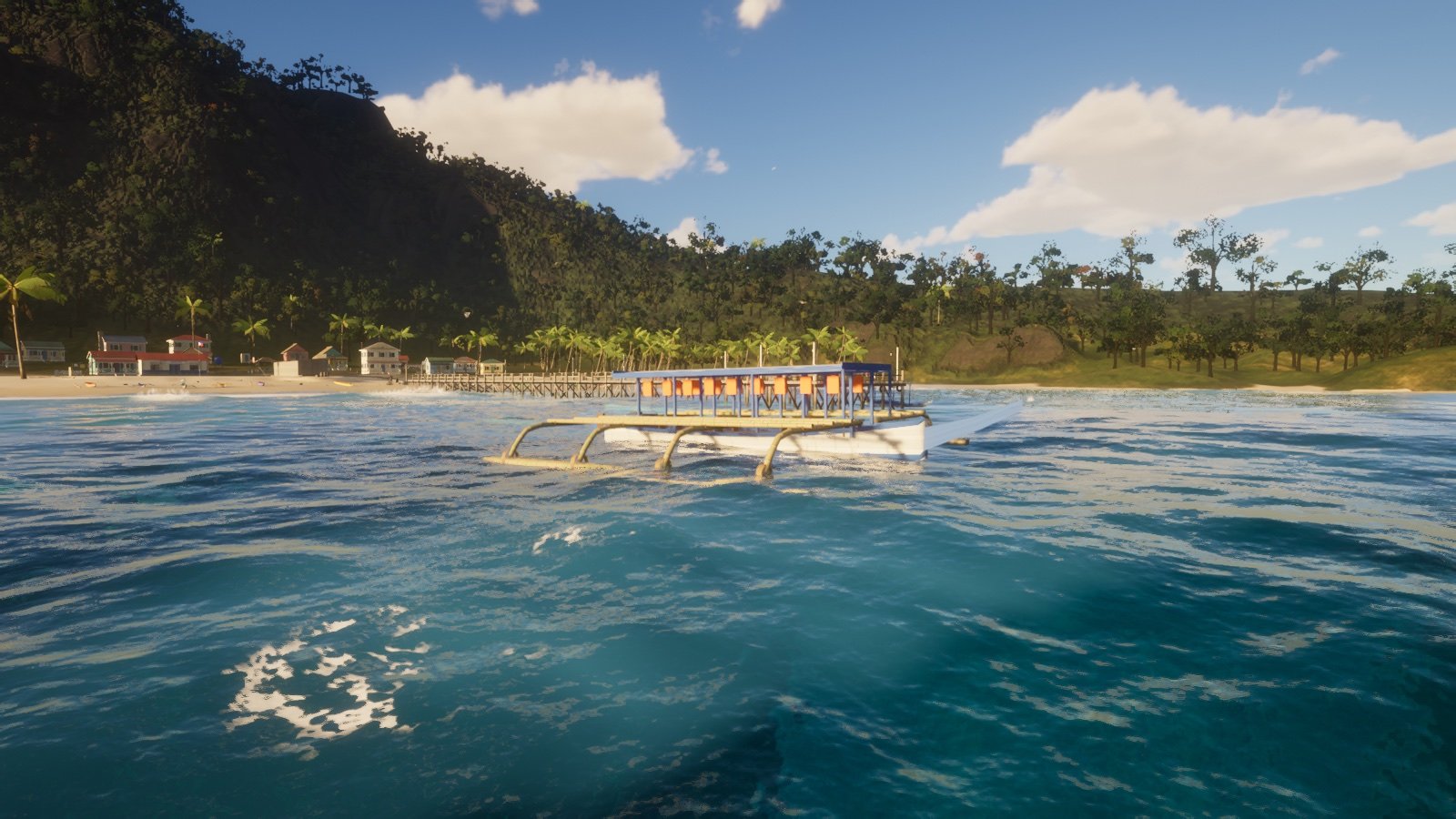 A white tourist bangka with blue outriggers and orange seats off the beach in Isda