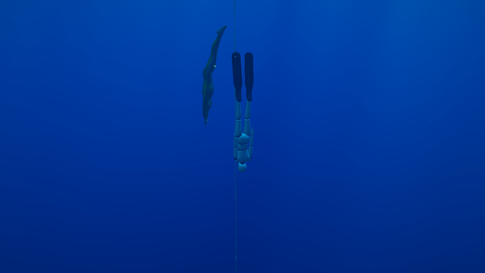 Two freedivers descending head-first down the dive line in deep blue water