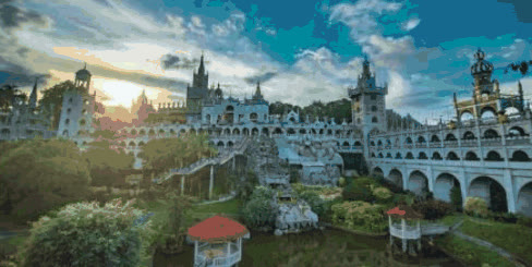 Castle-like Simala Shrine with gardens and a pond